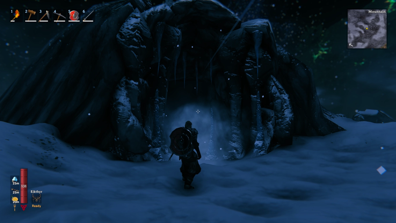 Entrance to a Frost Cave in Valheim’s Mountains with icy rock walls