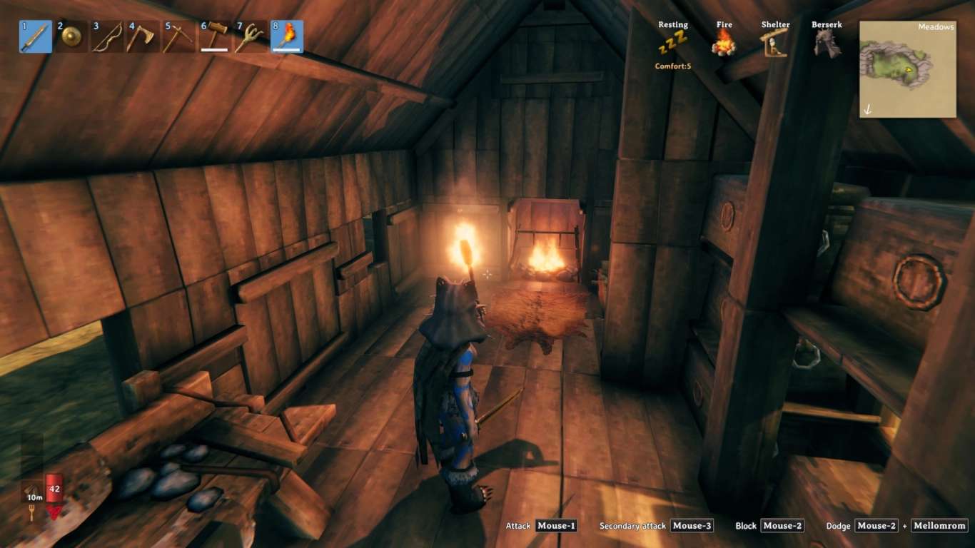 Valheim home setup with bed, storage, and early-game workbenches